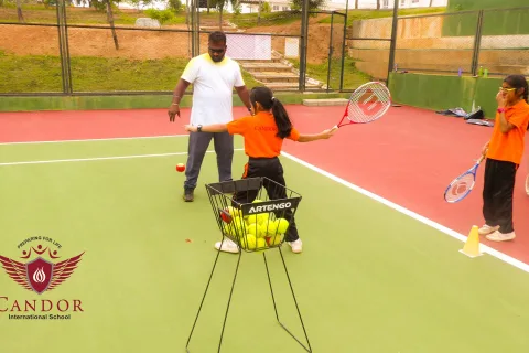 Grade 4 students learning to play Tennis.