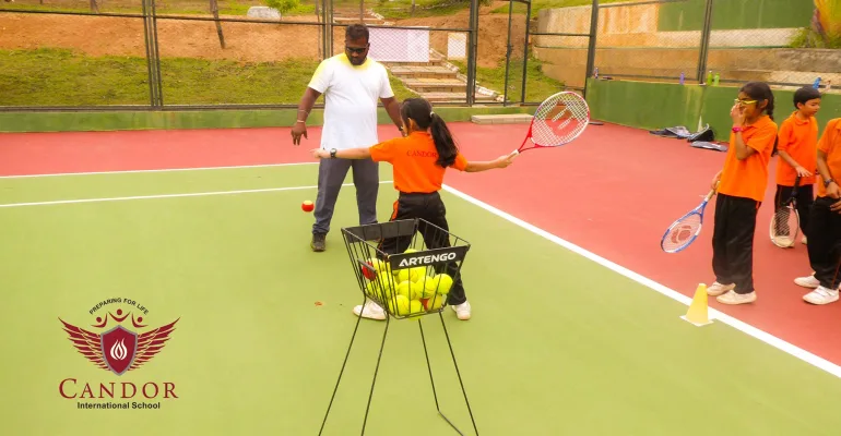 Grade 4 students learning to play Tennis.